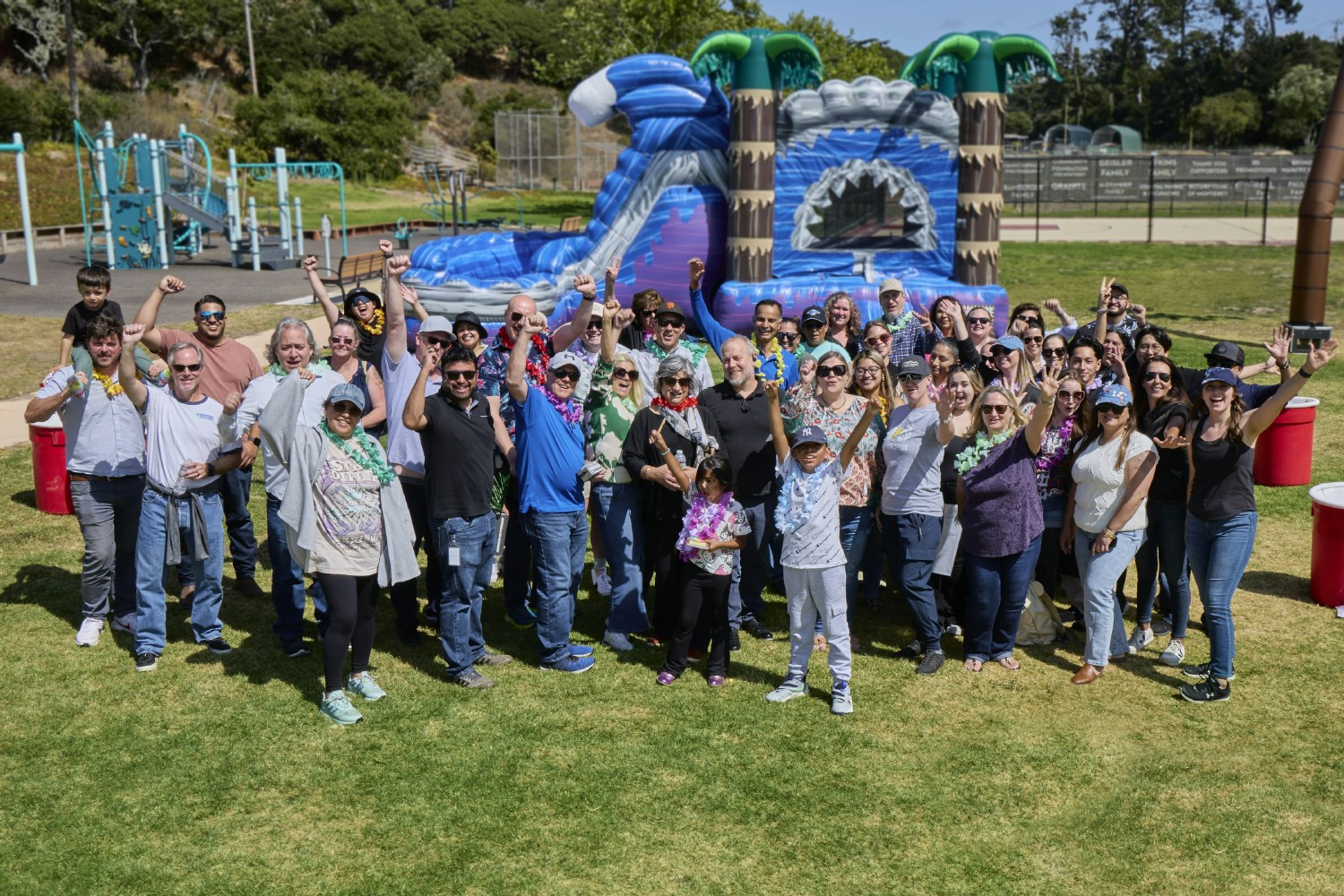 The Sales Team enjoying a photo with Miss Fanny Frog during their annual training. 