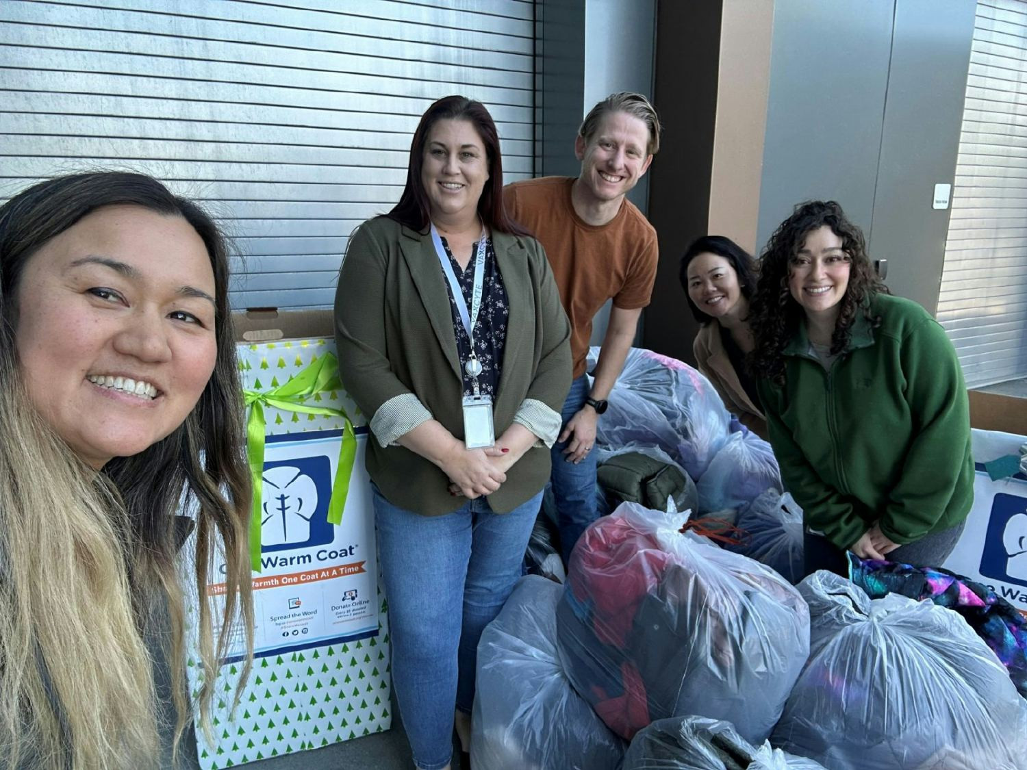Vaxcyte employees participating in a coat drive. 