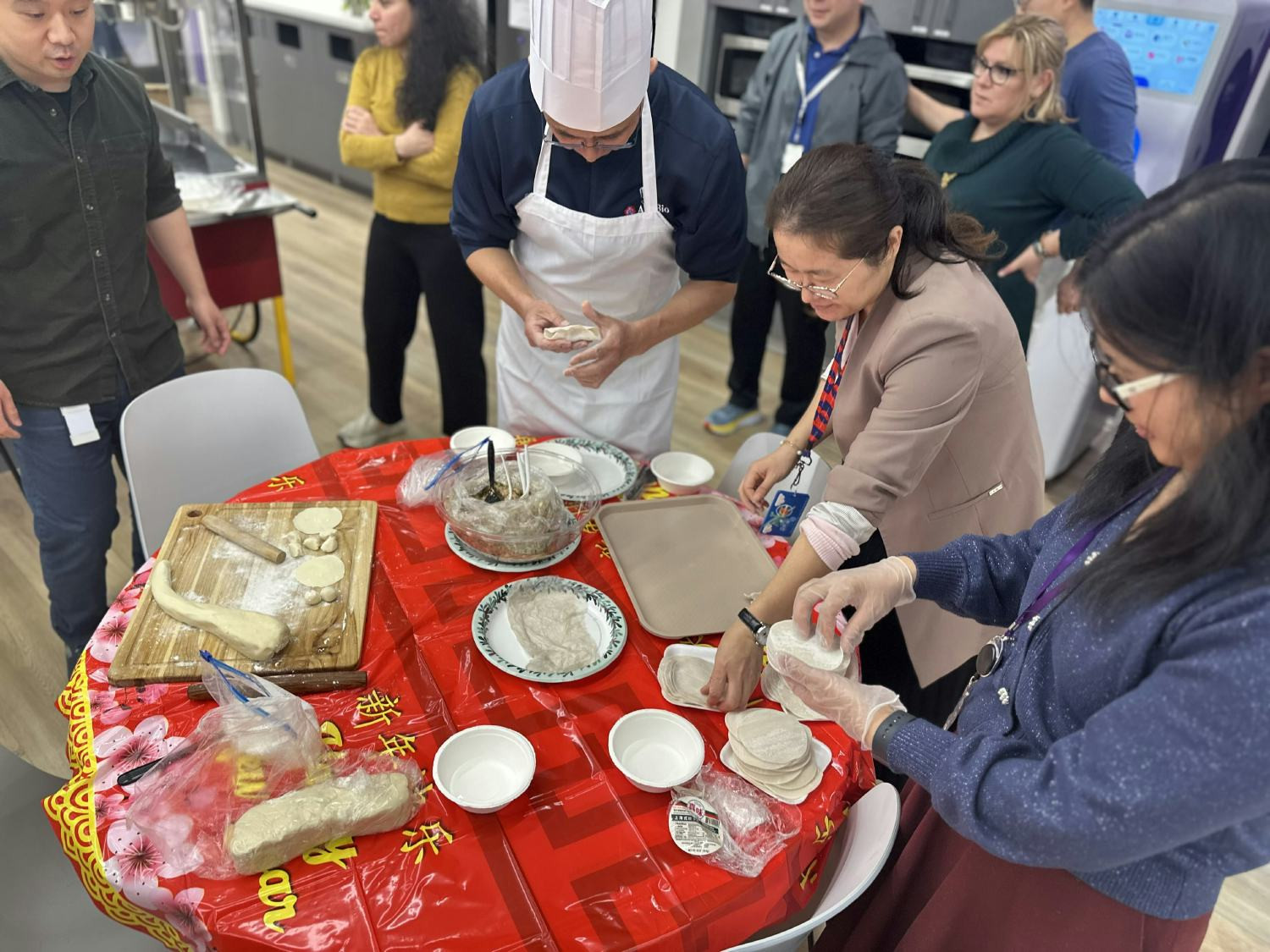 Lunar New Year at AskBio featured dumpling‑making by colleagues, celebrating shared culture and diverse experiences.