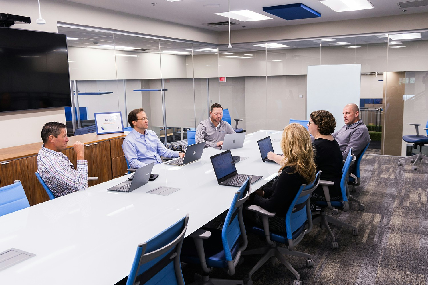 In our Sky Room, leaders collaborate on bold ideas—where transparency and teamwork drive innovation at Basys.