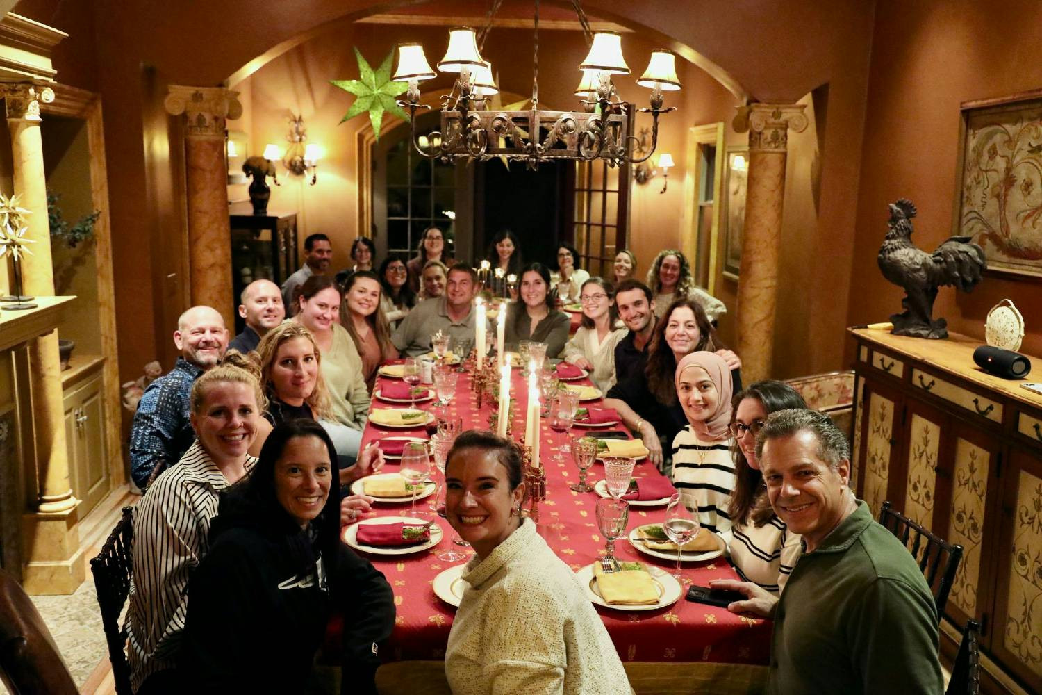 SCS Team sitting down family style for a meal to celebrate the recent wedding of our periodontist, Dr. Cicero! 