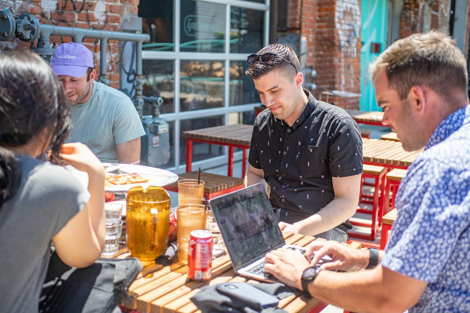 Stacker employees enjoying a productive working lunch outdoors