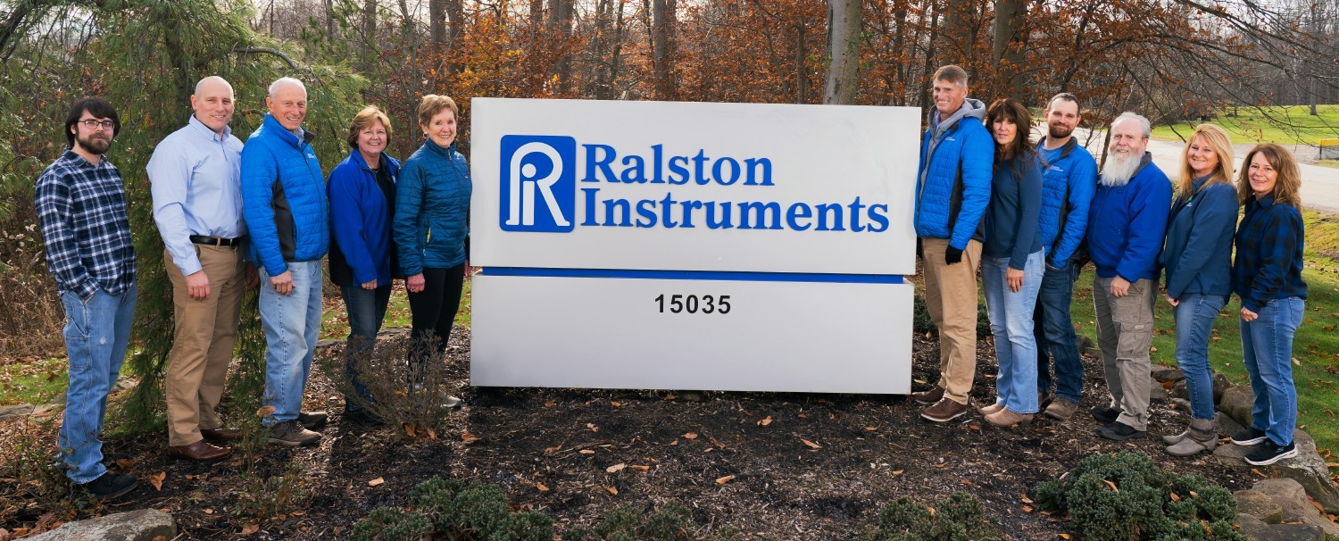 The Ralston Instruments team by our sign