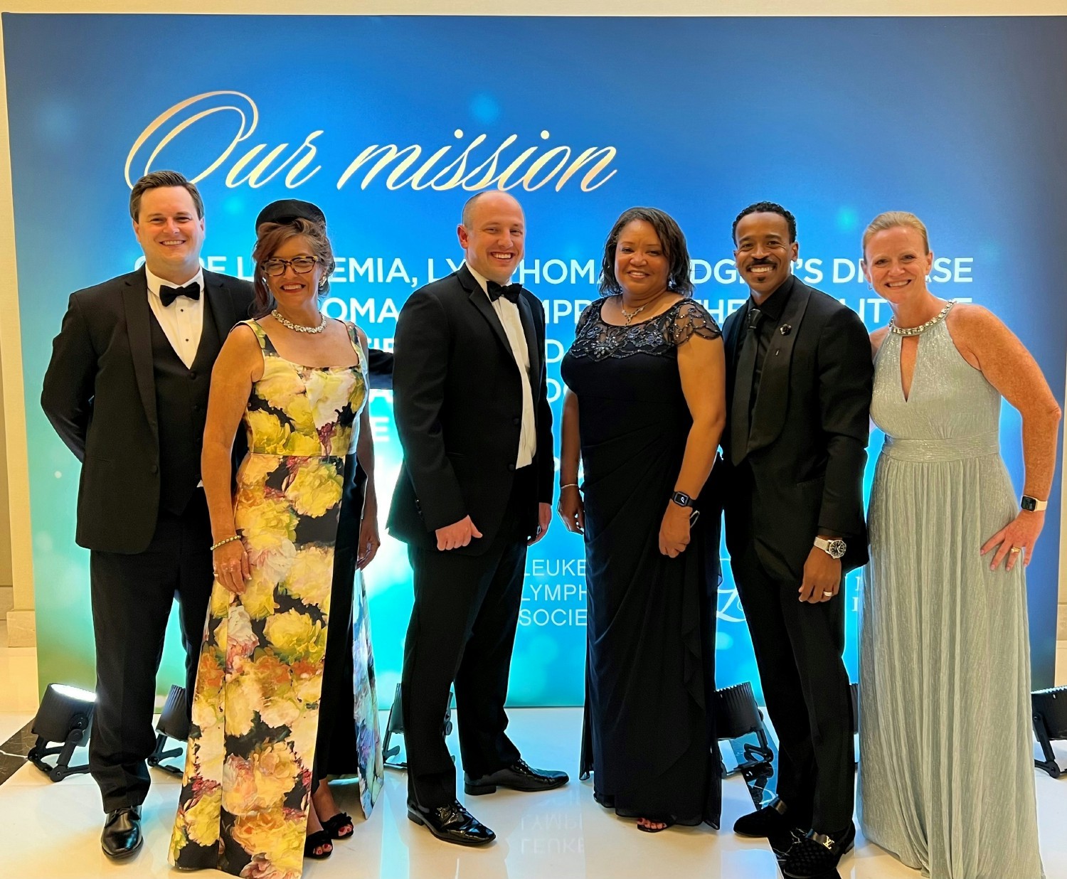 DLH leaders dressed fancy to support the Leukemia and Lymphoma Society's research efforts at a Black-Tie event.