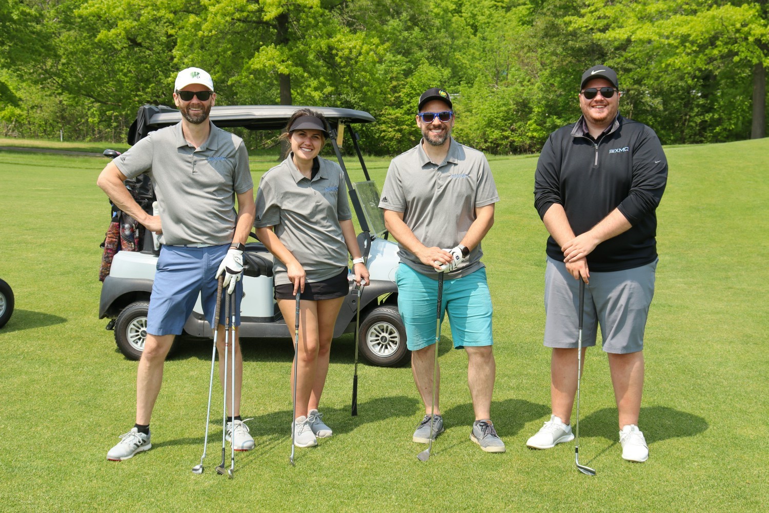 Several team members at a golf outing. 