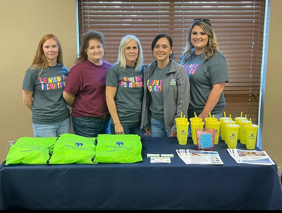 Employees host a community baby shower, providing essential gifts and support for local families in need