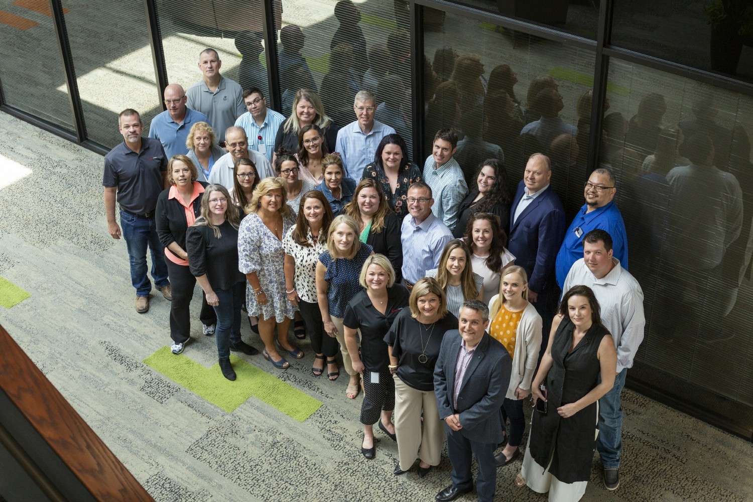 Employees from our physician services share a smile. 