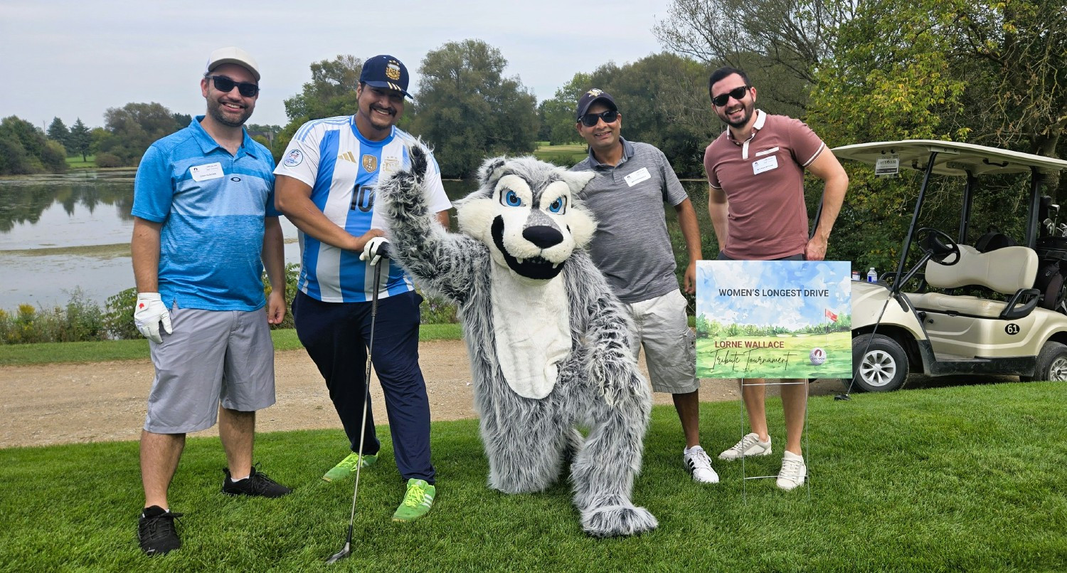 Lone Wolf Annual Golf Tournament. Having a little fun with our Mascot!