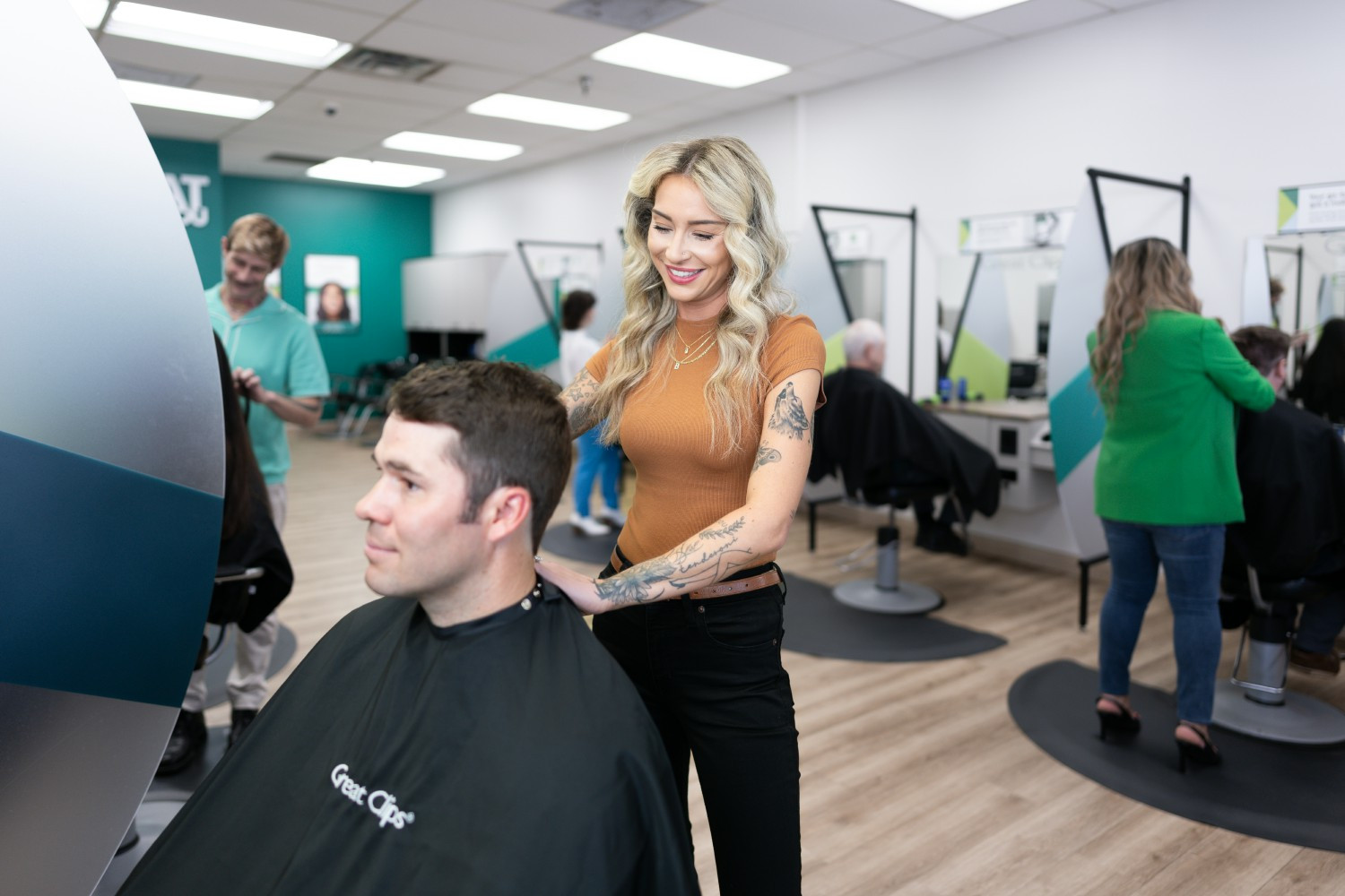 Stylist cutting hair