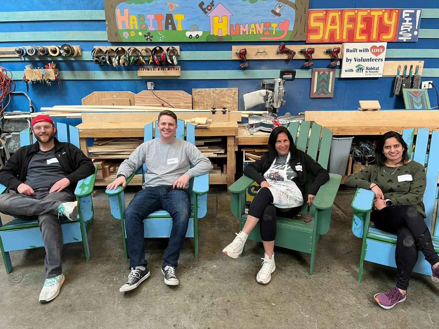 Volunteering in Habitat for Humanity- building chairs for community parks
