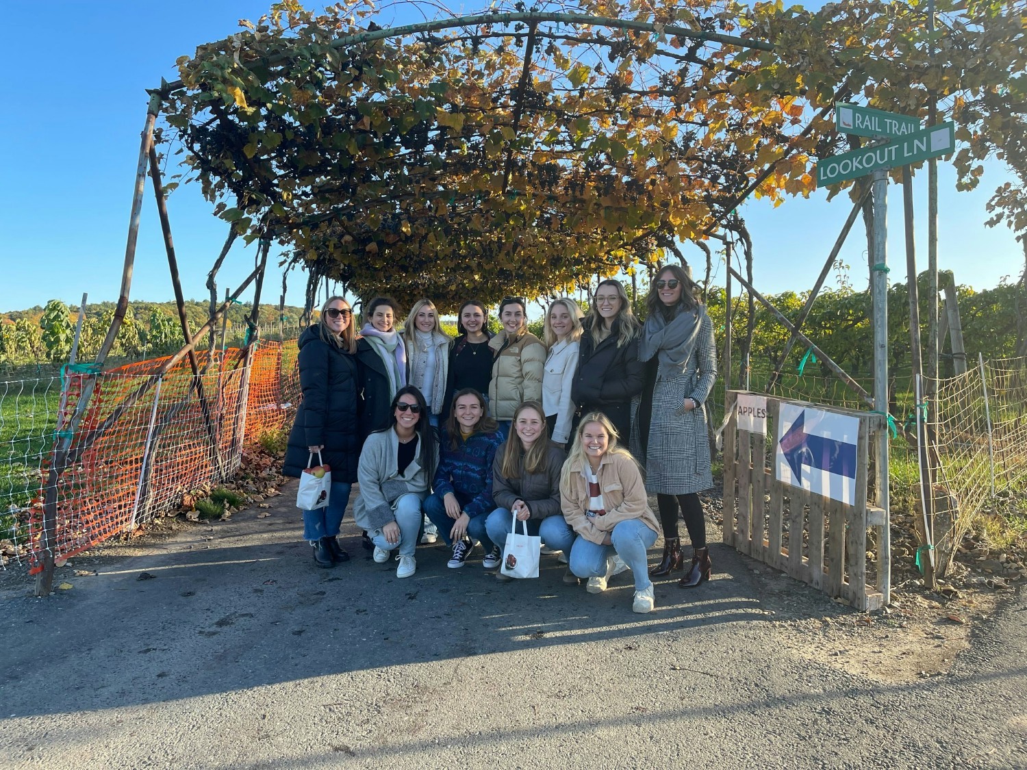 Some of the women of Paperless Parts apple picking in the fall. 