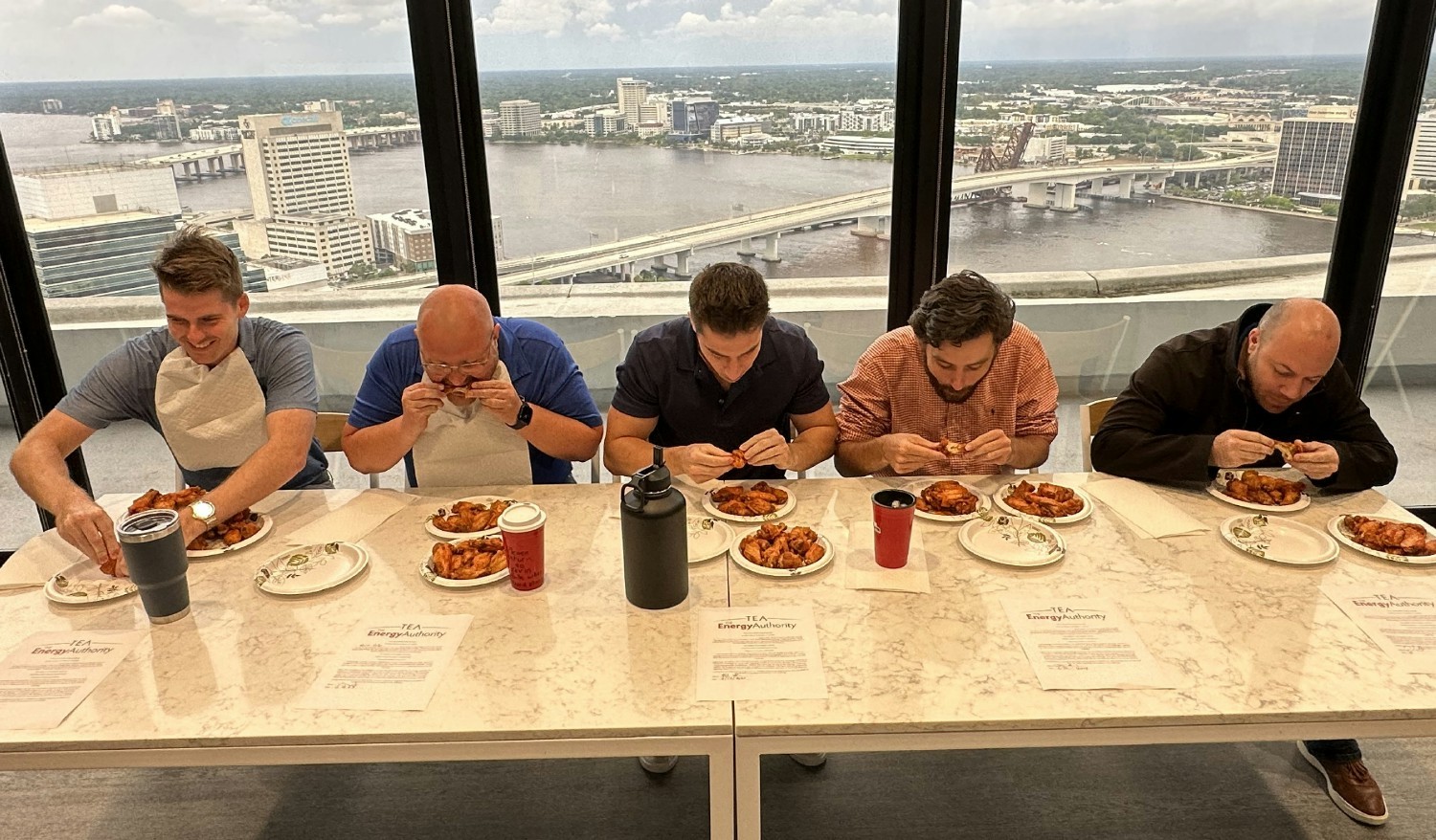 Employees compete in TEA's first-ever hot wing challenge, crowning the winner as the first person to finish 20 wings.