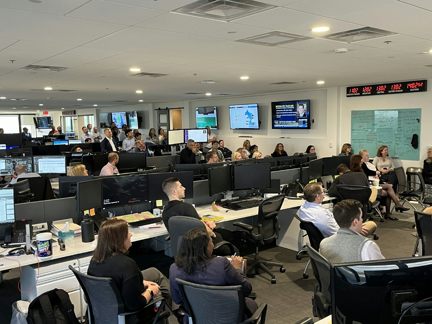 Employees attend a companywide Townhall, held on the East Coast Trade Floor and broadcast virtually.