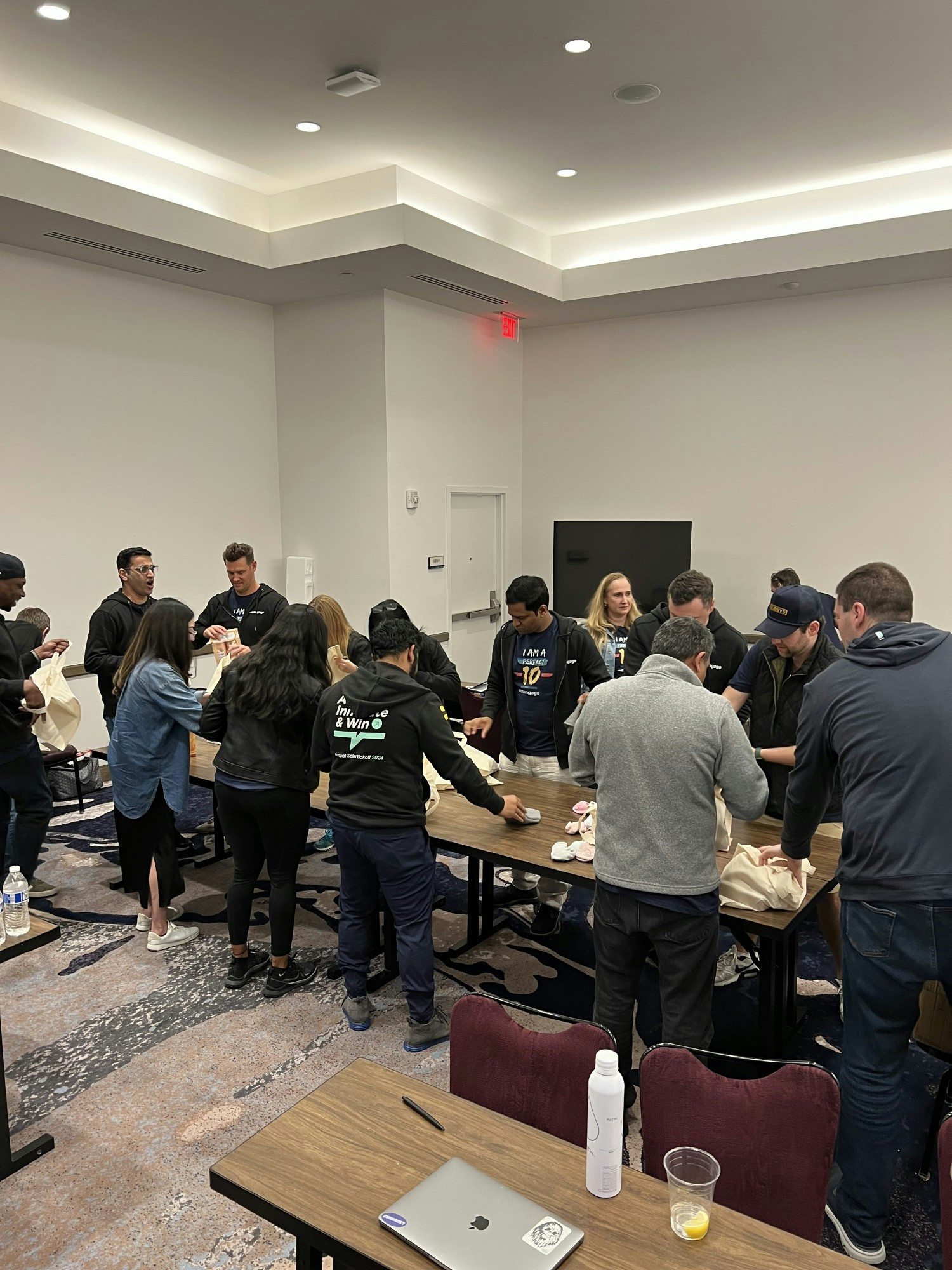Taking time during a meeting to put together over 100 care packages for a charity organization in Orlando.