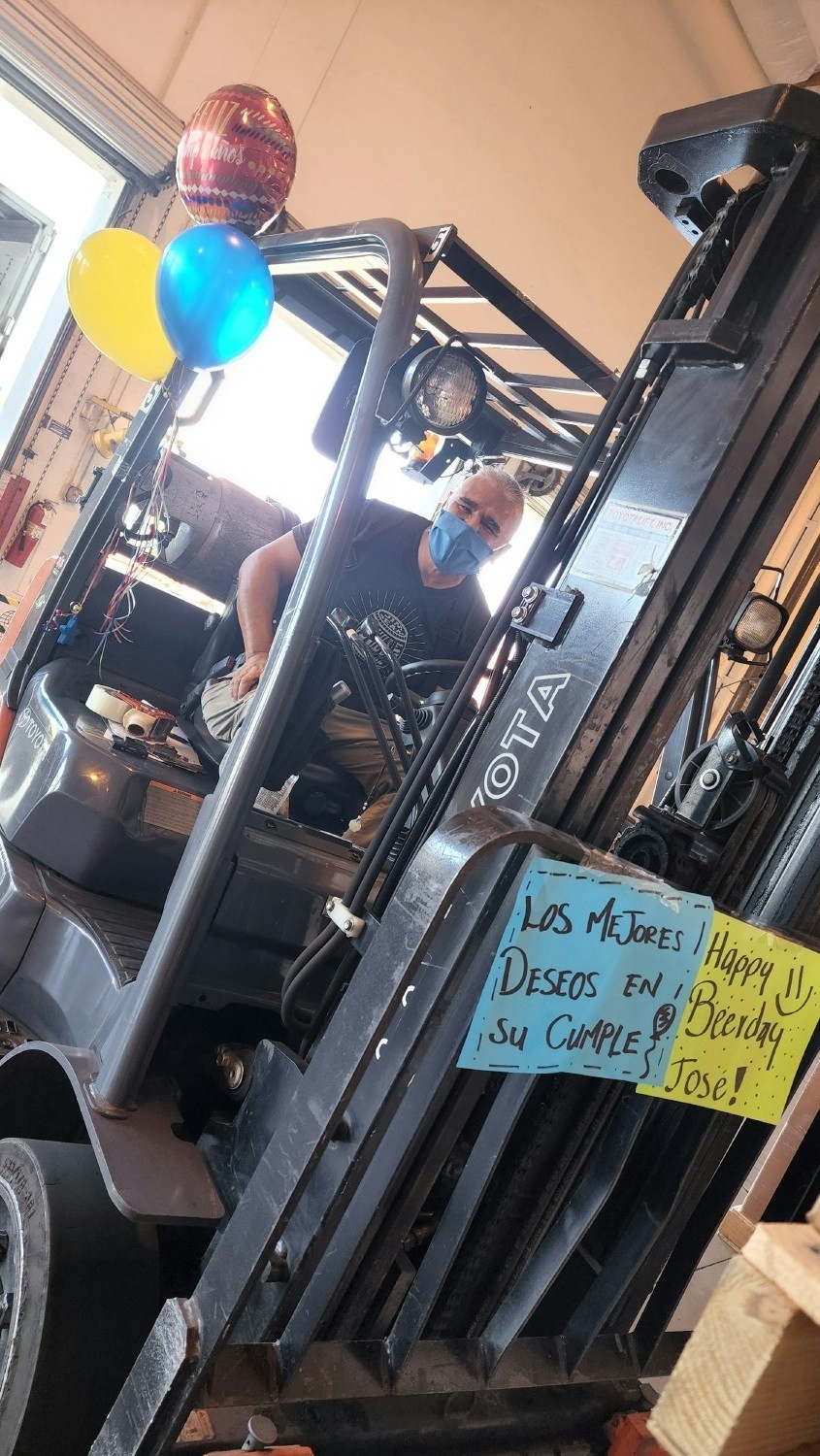 Decorating his forklift to celebrate Jose's Birthday