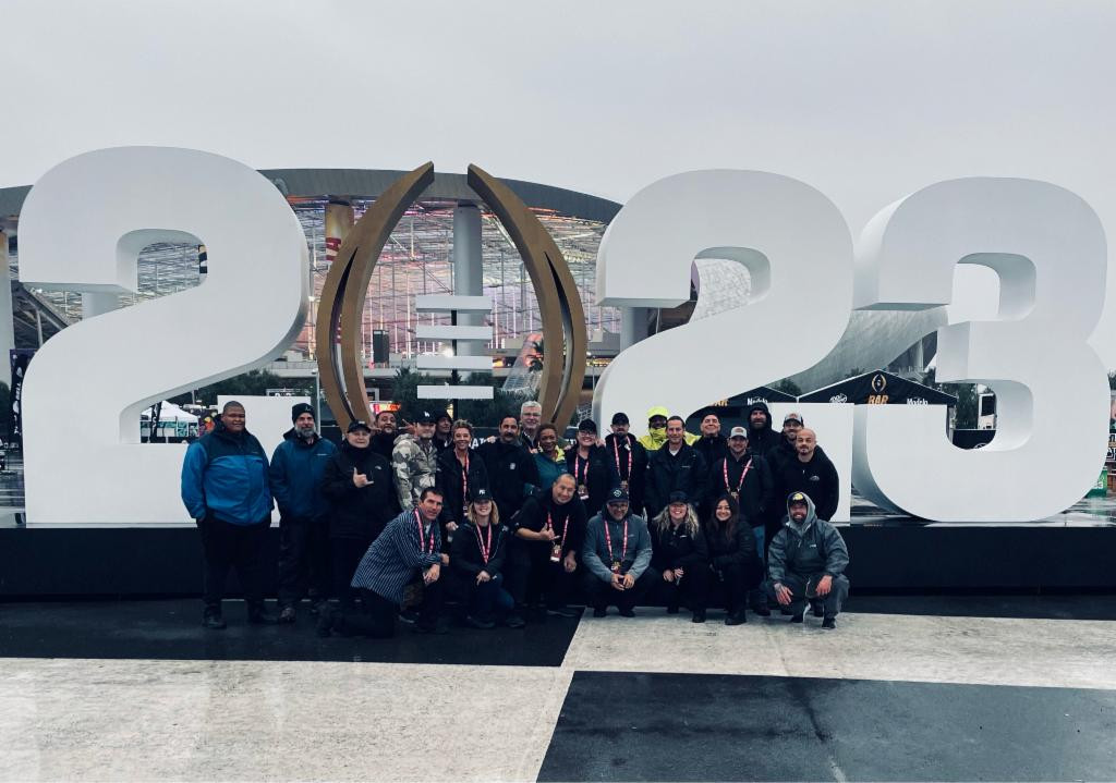 Team photo after a working a rainy event during the 2023 CFP