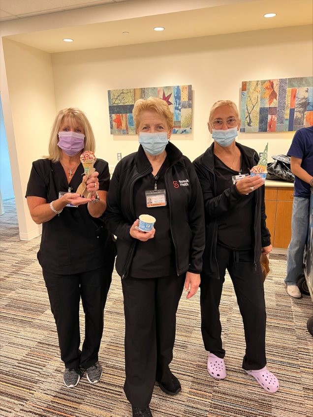 Team members enjoying free ice cream on-site during National Ice Cream Month! Well deserved! 