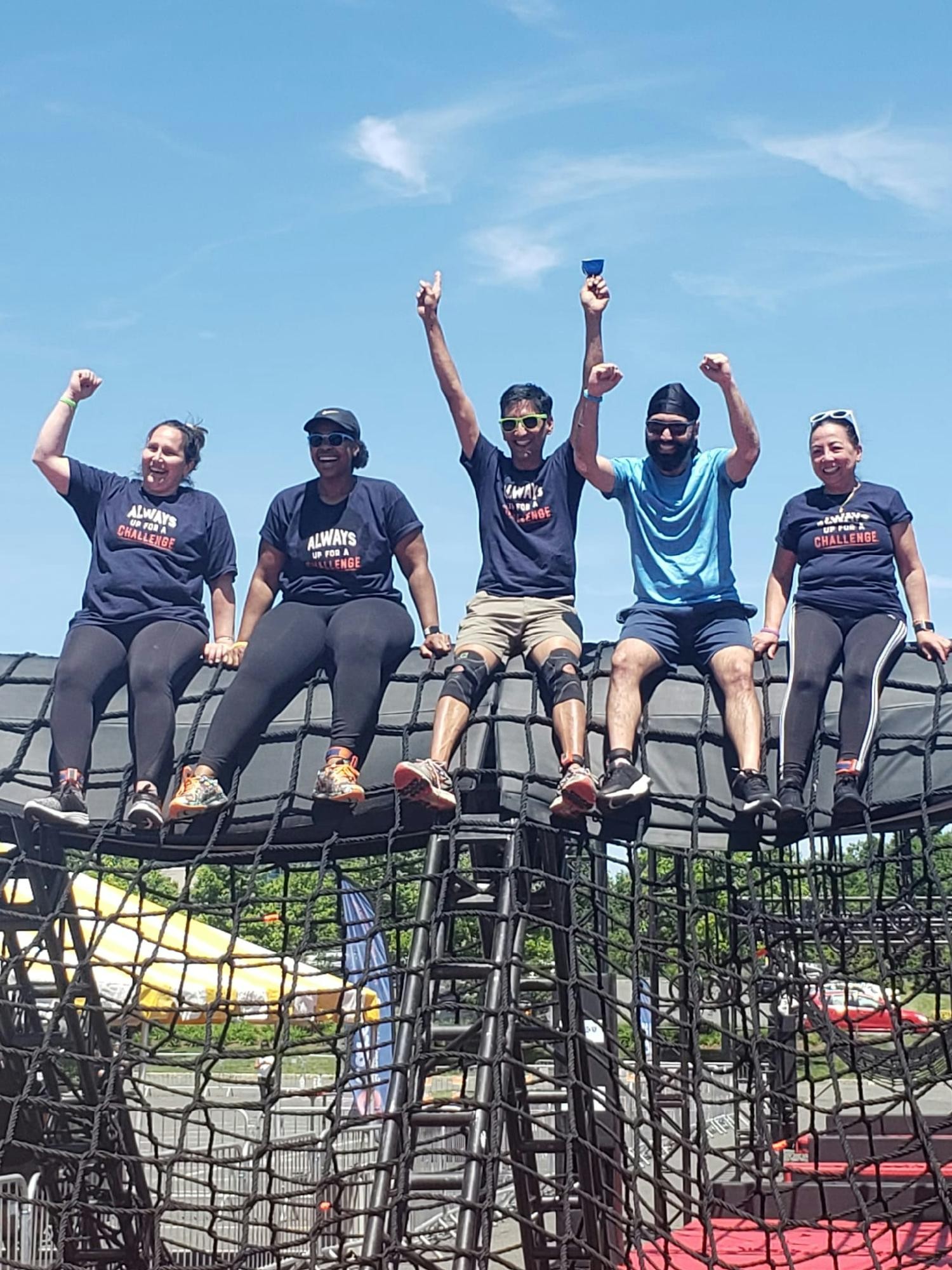 Team members celebrating the conquering of obstacles and a successful Summit Health Cares Challenge!