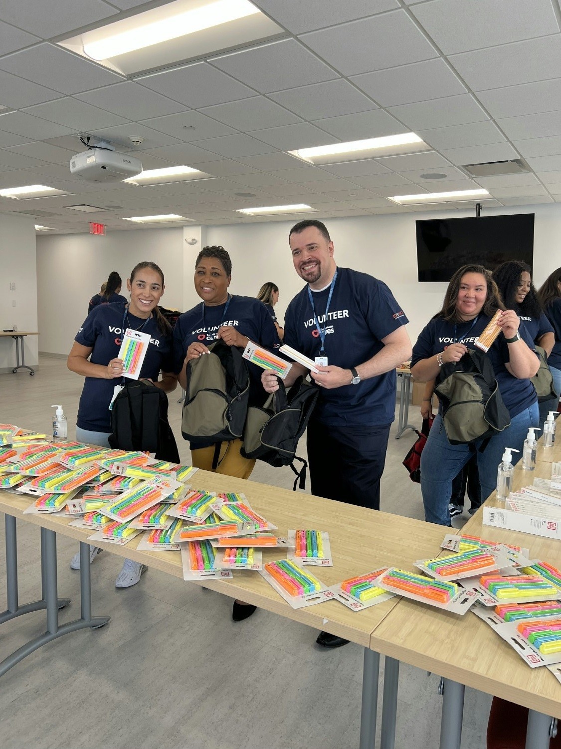 Team members volunteering at a summit health cares event.