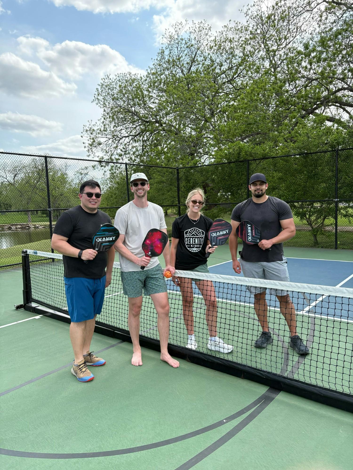 The team showing off their pickleball skills - serving up fun, focus, and spirited energy!