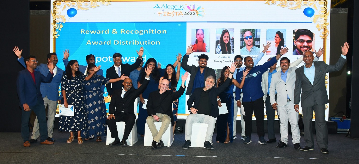 Leaders from Alegeus join local colleagues in Bangalore, India to celebrate exceptional performance milestones.