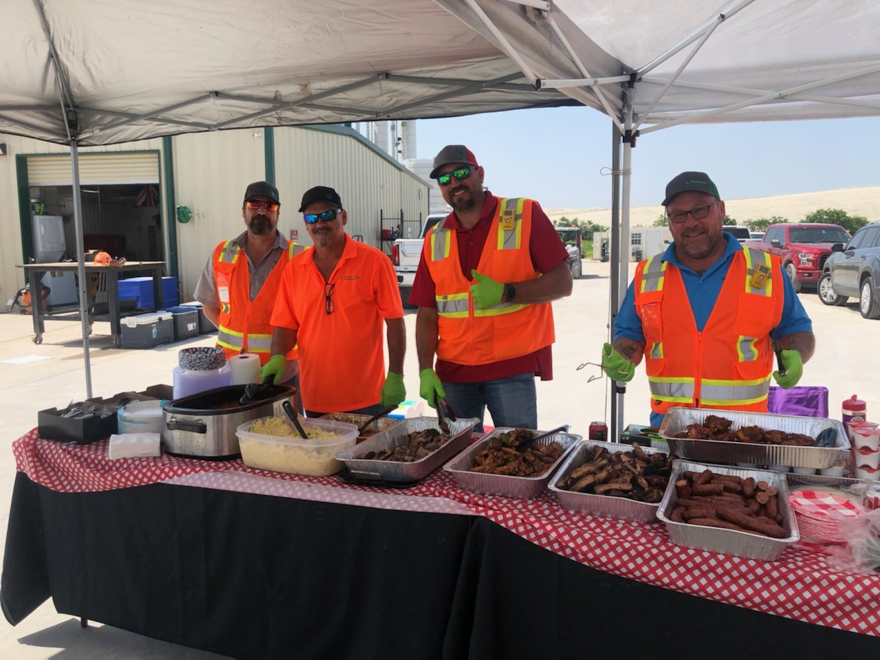 The Management team serving up some BBQ for our hungry team.