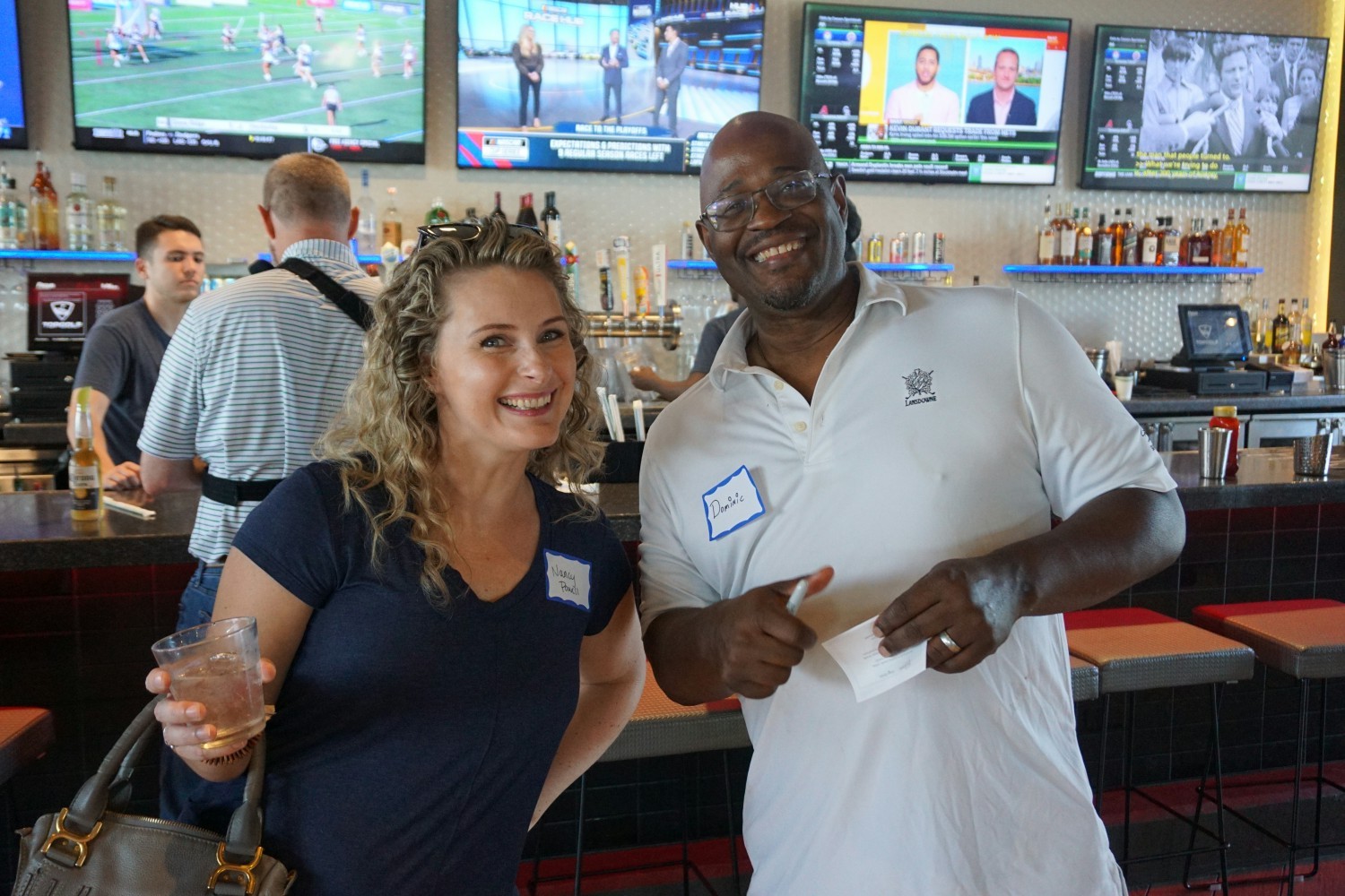 Nancy Power, VP of Delivery and Dominic, CFO taking a break from golf at our Summer All Hands Party 