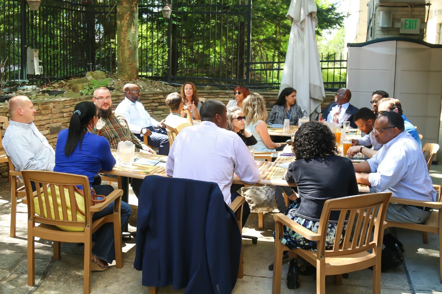 VersaTech team members taking advantage of a beautiful summer day for a team happy hour.