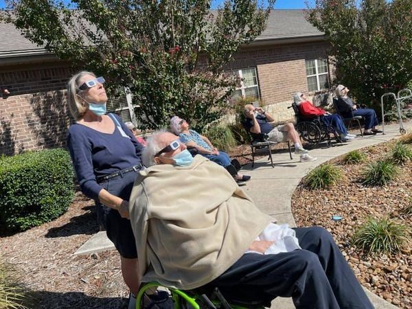 Several residents enjoyed watching the eclipse in the lovely courtyard of the facility. 