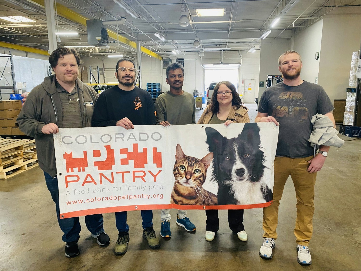 Colorado Team Members volunteering at the local Pet Pantry, serving our community and their furry loved ones. 