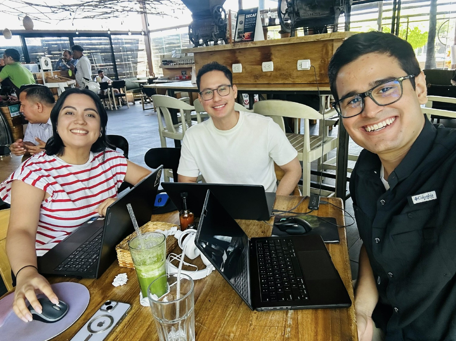 Three remote employees working at lunch together