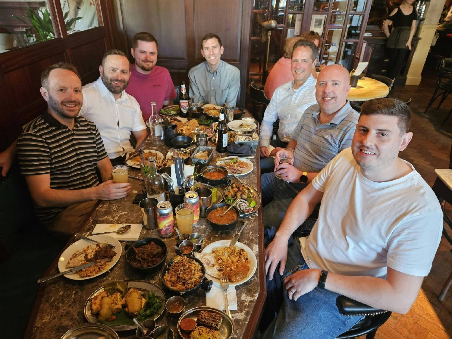 Our UK team members at a group dinner in Brighton, England.