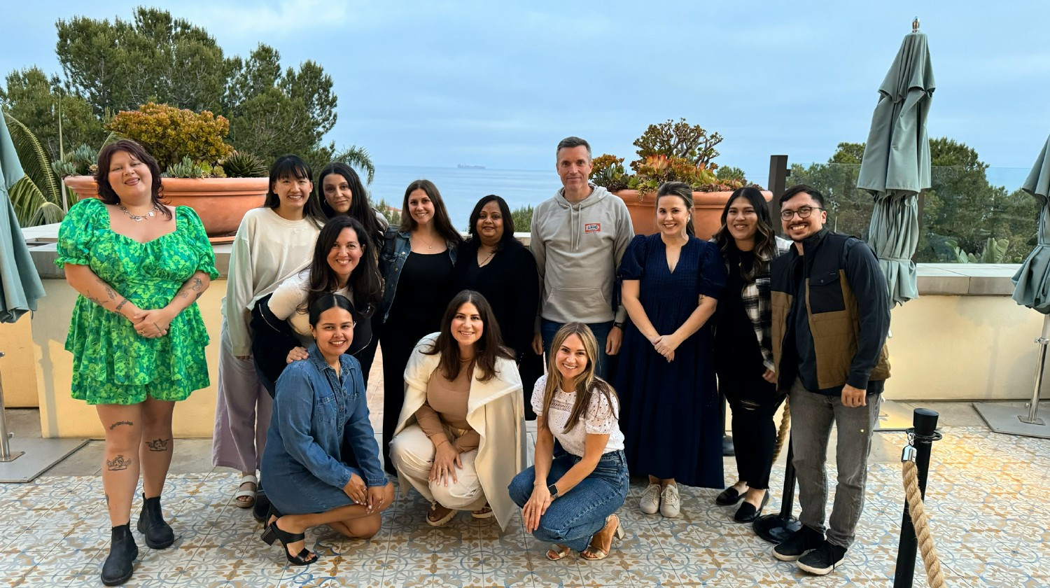 Finance and People gathered by the beach for their annual department off-site.
