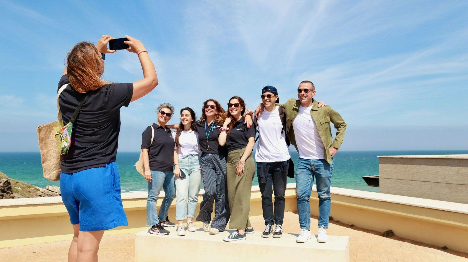 Building Healthier Communities: Colleagues spending quality time together giving back at a local beach cleanup.