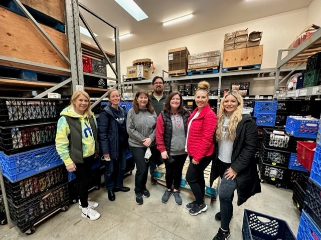 Admiral Advocates serve our communities by volunteering at a local food bank