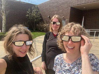 SCPH's Women, Infant, and Children staff wearing solar glasses on eclipse day.