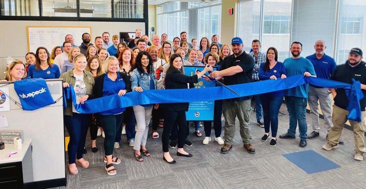 Teammates in Sioux Falls celebrate the official rebrand to Bluepeak with a ribbon-cutting ceremony on June 1, 2022. 