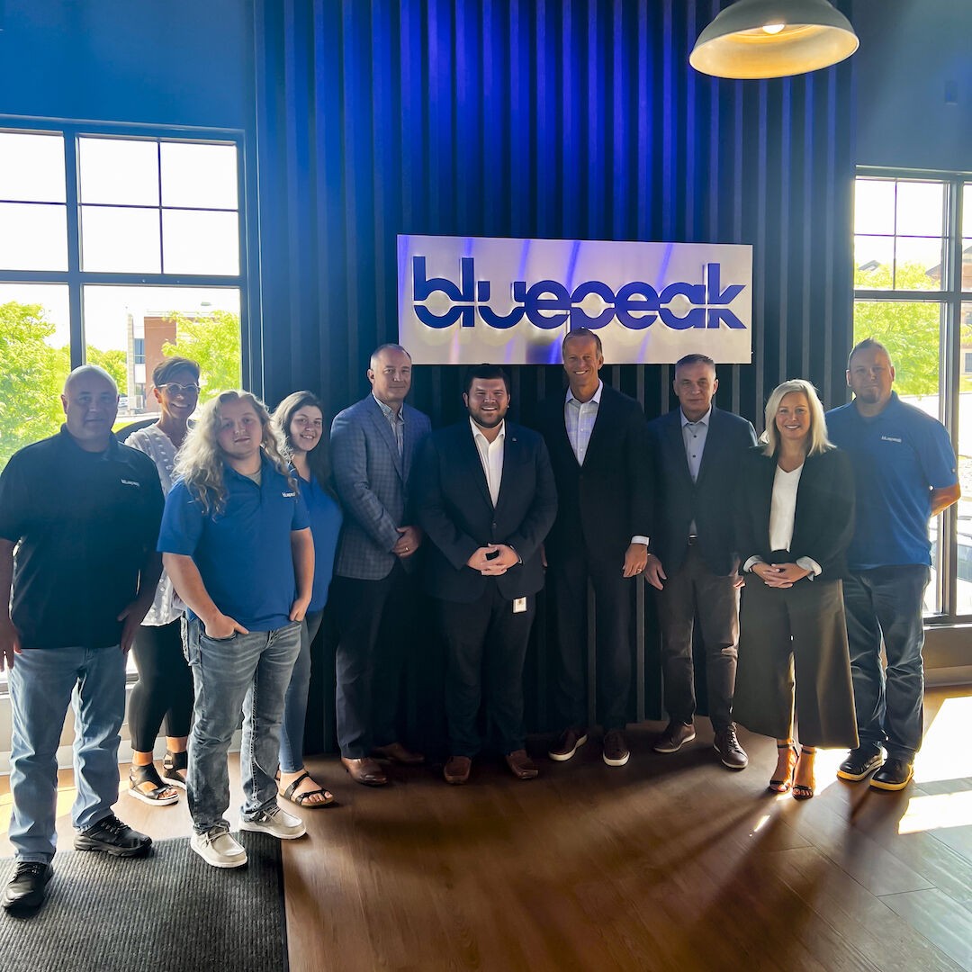 The Bluepeak team stands with U.S. Senator John Thune of South Dakota at the Sioux Falls Tech Hub on Aug. 25, 2023. 
