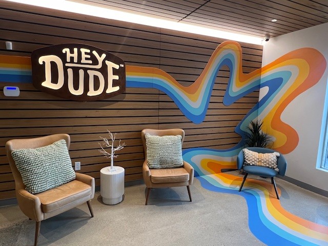 Picture of the HEYDUDE lobby at our Westwood, MA office opened in Spring of 2023.
