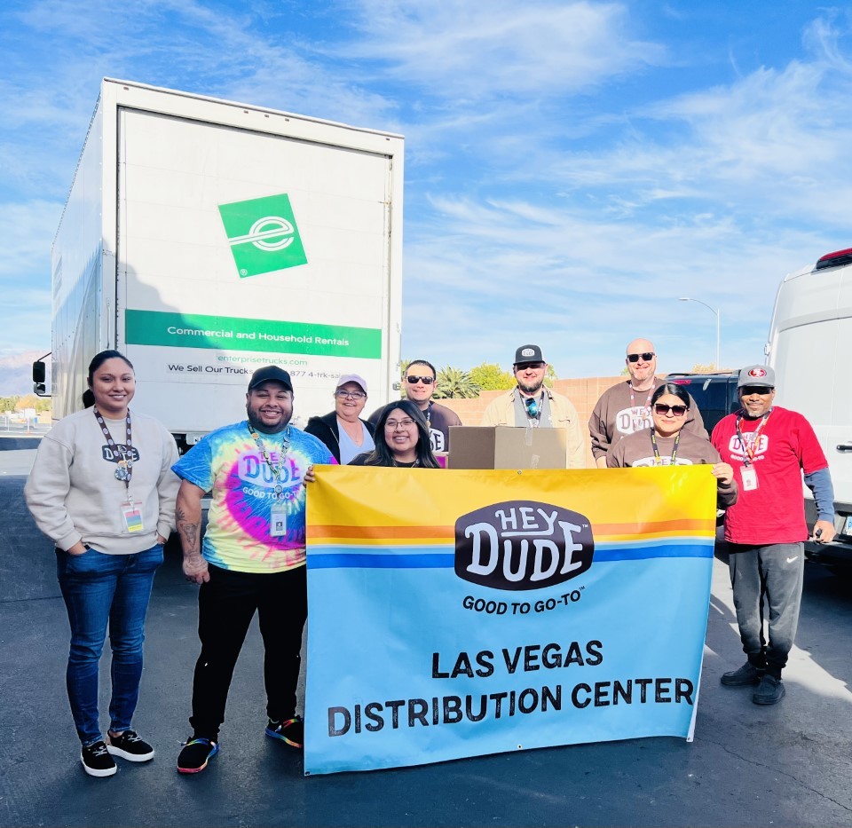 Picture of our HEYDUDE Las Vegas Distribution Center team partners getting ready to head out to a volunteering event.