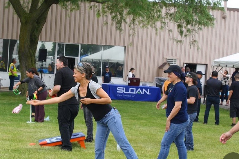 Sloan employees come together to celebrate, connect, and build relationships during a company summer BBQ. 