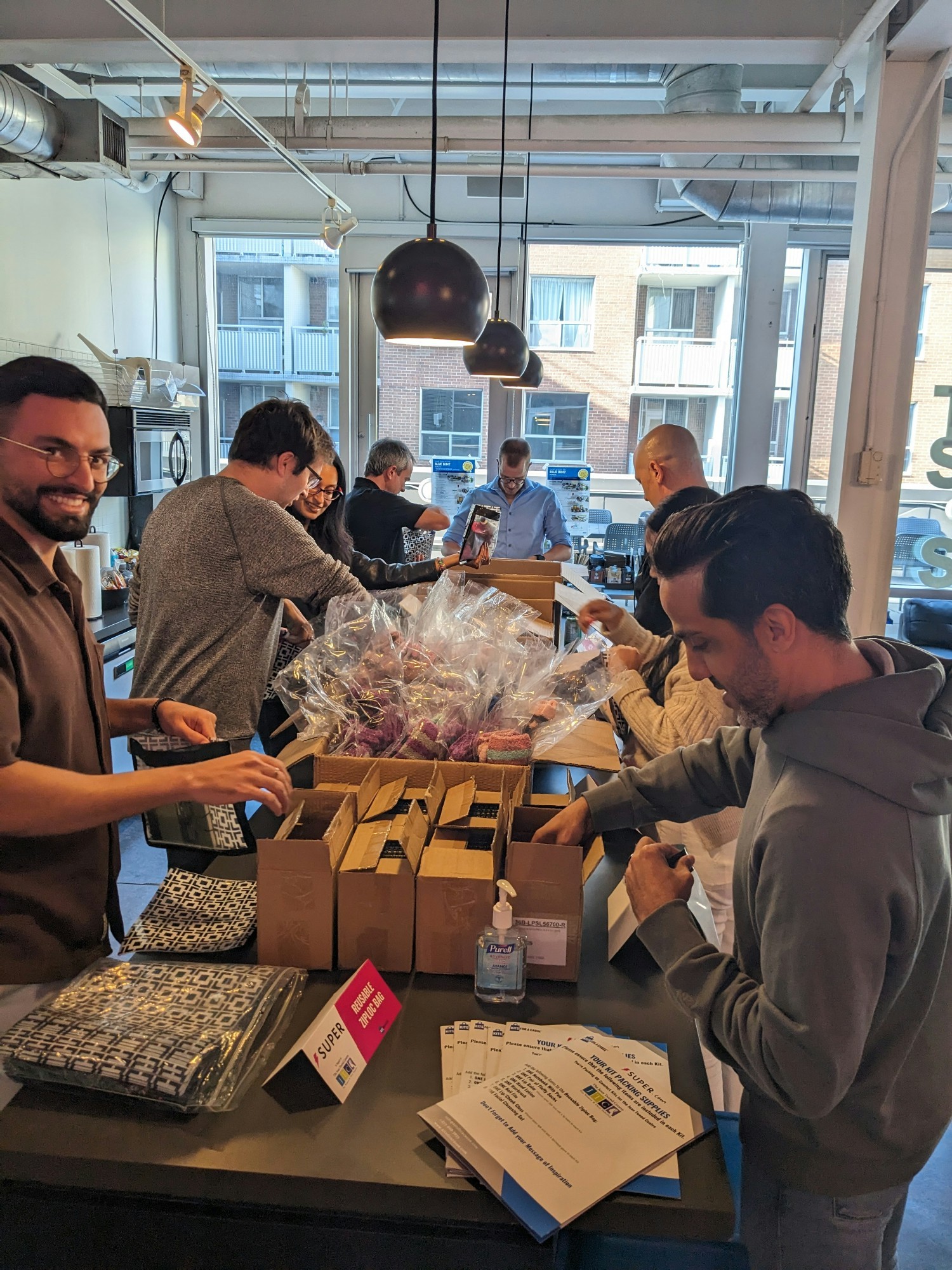 Our leadership team at their offsite packing KitsForACause boxes!