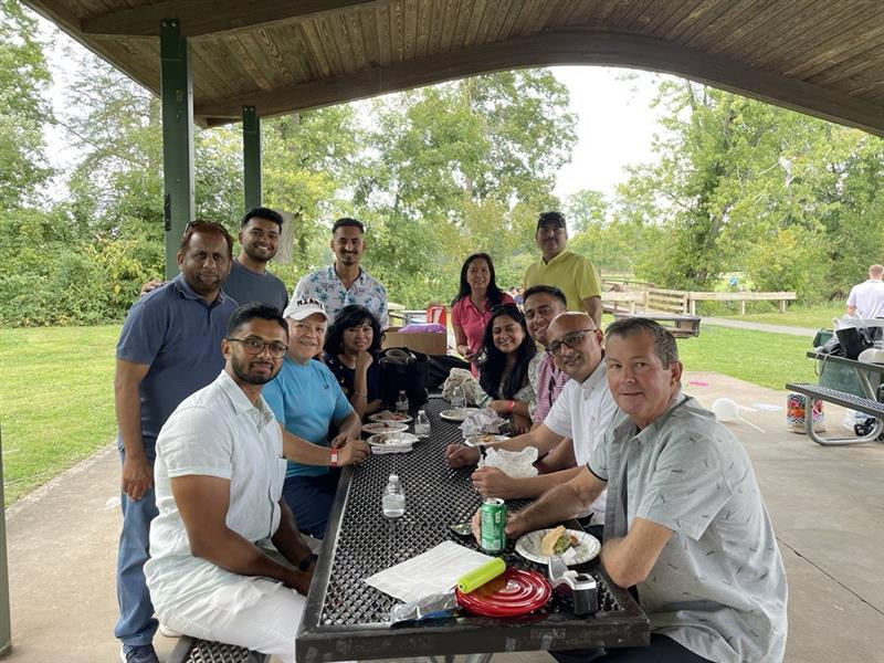 Enjoying the great outdoors and even better company at our annual company picnic.