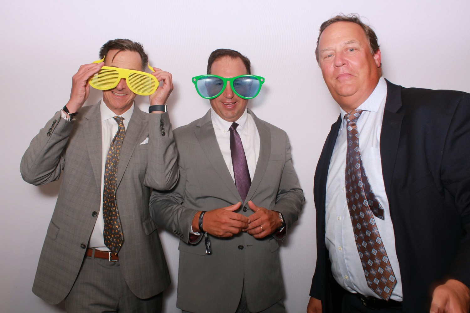 3 highest ranking members having some fun at an event.  CEO and 2 President's over Business Units.
