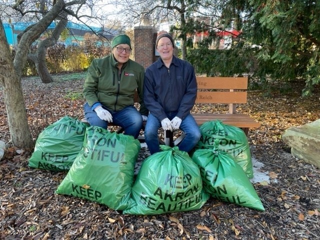 John and Laurie cleaning up the flower bed that ATA sponsors through Keep Akron Beautiful.  