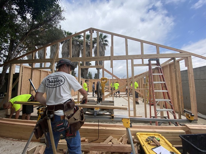 Many of our employees participate in volunteer opportunities.    One employee in Mexico building a house for a family. 
