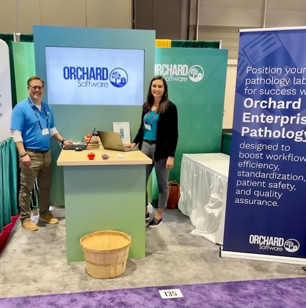 Orchard employees ready to talk about our products at a laboratory trade show. 