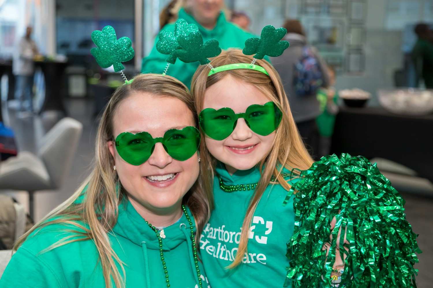 Hartford HealthCare colleagues and their families participate in the St. Patrick's Day Parade