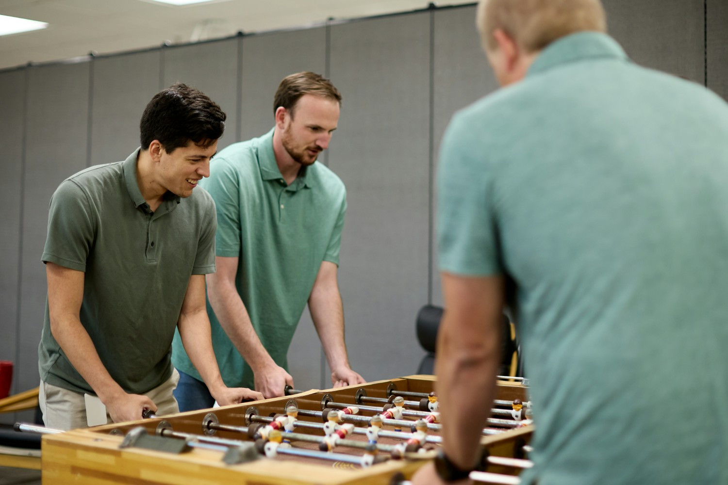 Quartusonians letting off some steam in a competitive game of foosball. 