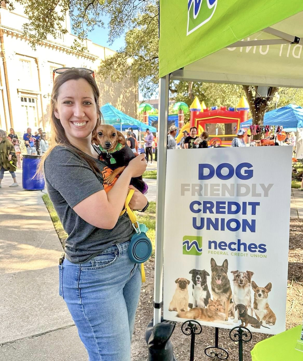 NFCU Employee + their furry companion at the Annual Dogtober Fest Event